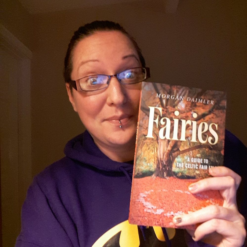 Lora with the book Fairies by Morgan Daimler